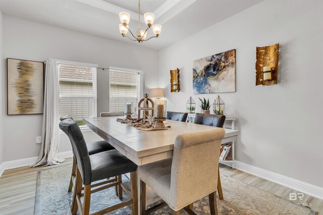 3905 Mercury Cir, Gulf Shores, AL 36542 - dining room with baseboards, light wood-style floors, and an inviting chandelier