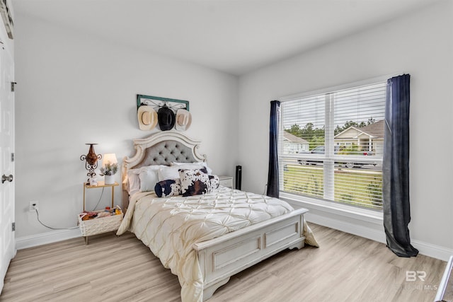 3905 Mercury Cir, Gulf Shores, AL 36542 - bedroom with light wood-style flooring and baseboards