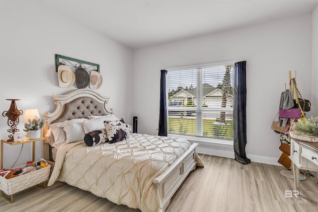 3905 Mercury Cir, Gulf Shores, AL 36542 - bedroom featuring baseboards and light wood-type flooring