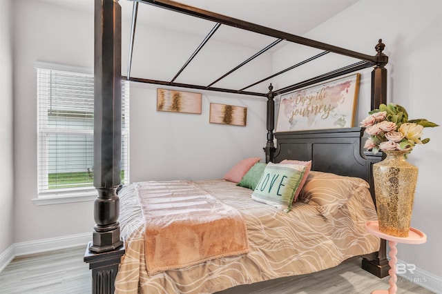 3905 Mercury Cir, Gulf Shores, AL 36542 - bedroom with baseboards and wood finished floors