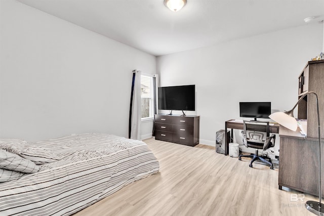 3905 Mercury Cir, Gulf Shores, AL 36542 - bedroom with baseboards and light wood-style floors