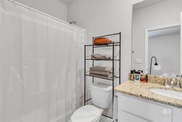 3905 Mercury Cir, Gulf Shores, AL 36542 - bathroom with vanity, toilet, and a shower with shower curtain