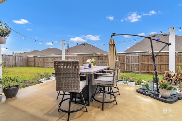 3905 Mercury Cir, Gulf Shores, AL 36542 - view of patio featuring outdoor dining space and a fenced backyard