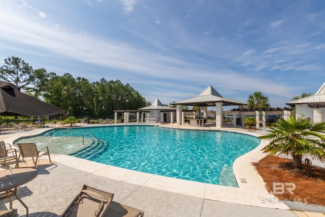 3905 Mercury Cir, Gulf Shores, AL 36542 - community pool with a gazebo, a patio, and fence
