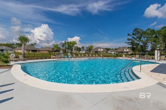 3905 Mercury Cir, Gulf Shores, AL 36542 - pool with a patio, a residential view, and fence