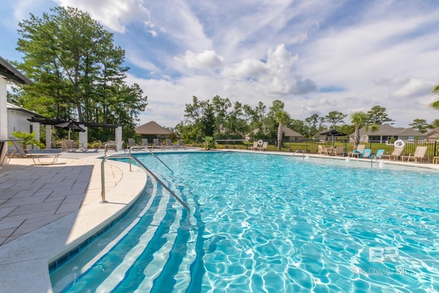3905 Mercury Cir, Gulf Shores, AL 36542 - community pool with a patio and fence