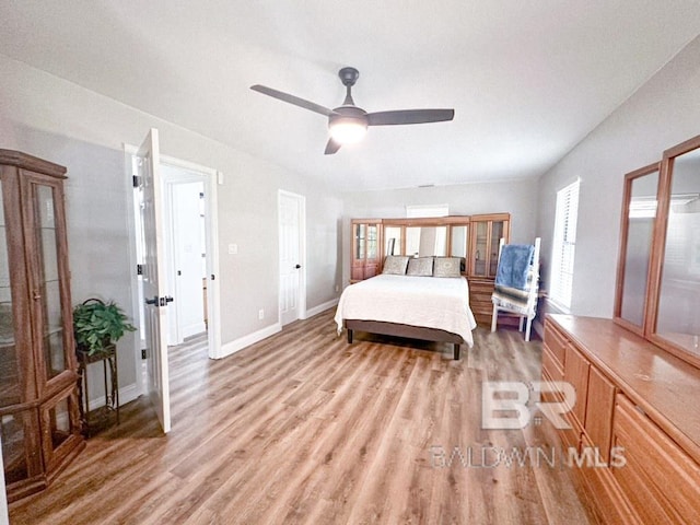 bedroom featuring ceiling fan and wood-type flooring