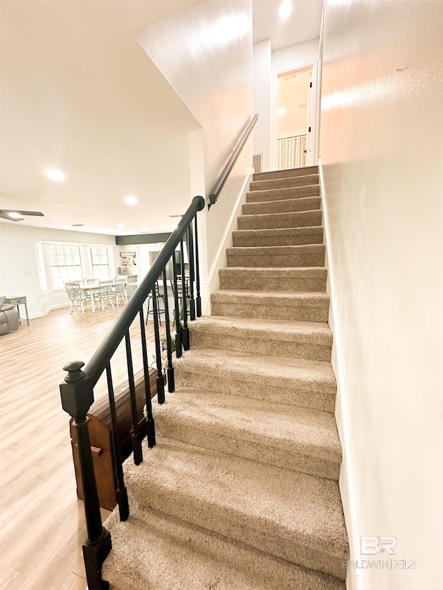 stairs with wood-type flooring