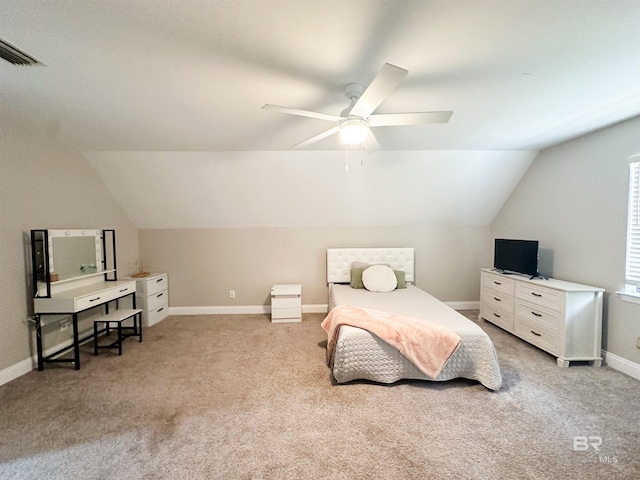 bedroom featuring ceiling fan, light colored carpet, and lofted ceiling