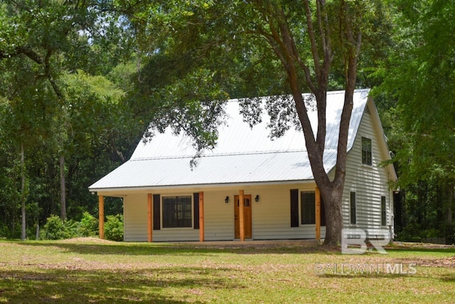 view of front of house with a front yard and a porch