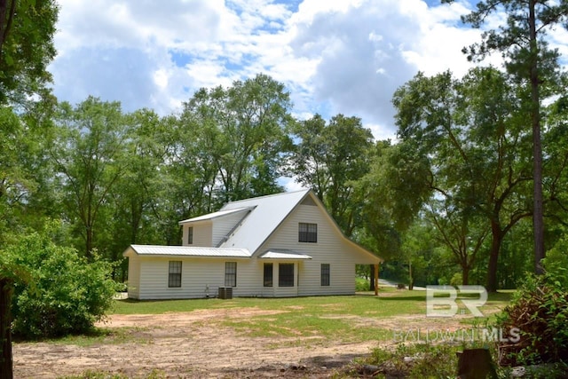 back of property with a yard