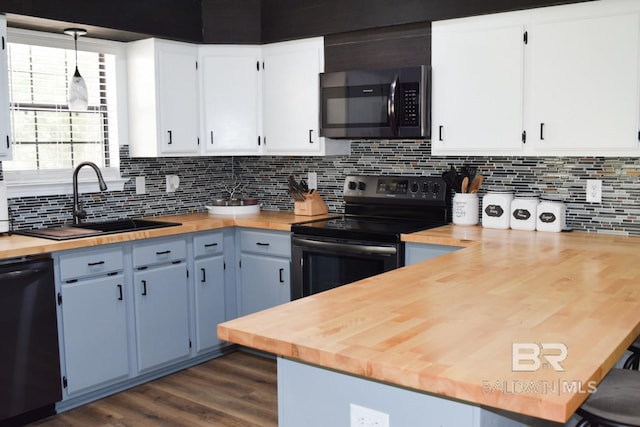 kitchen with backsplash, pendant lighting, dishwasher, and range with electric stovetop