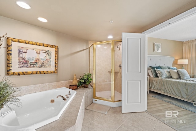 ensuite bathroom featuring a stall shower, a tub with jets, connected bathroom, and tile patterned floors