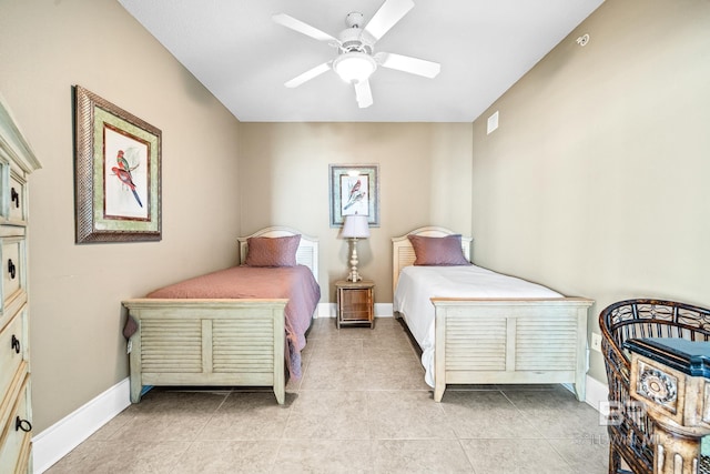 bedroom featuring light tile patterned floors, a ceiling fan, visible vents, and baseboards