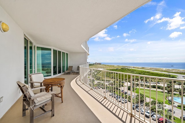 balcony featuring a water view