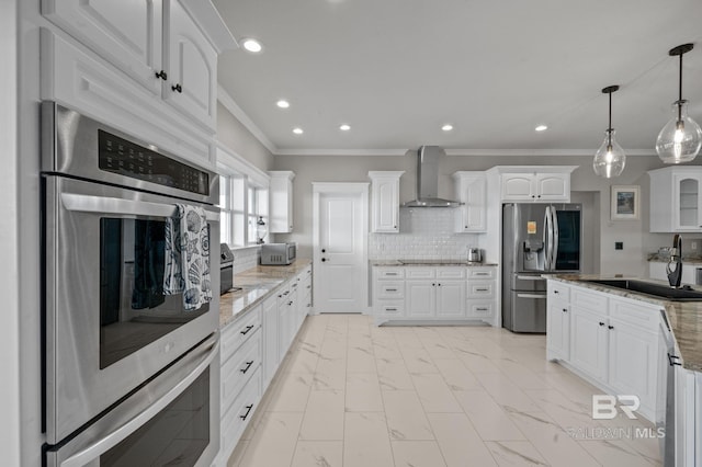 2420 Bienville Blvd, Dauphin Island, AL 36528 - kitchen featuring wall chimney range hood, appliances with stainless steel finishes, a sink, ornamental molding, and white cabinets