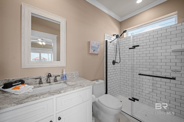 2420 Bienville Blvd, Dauphin Island, AL 36528 - bathroom featuring a stall shower, toilet, vanity, ornamental molding, and a ceiling fan