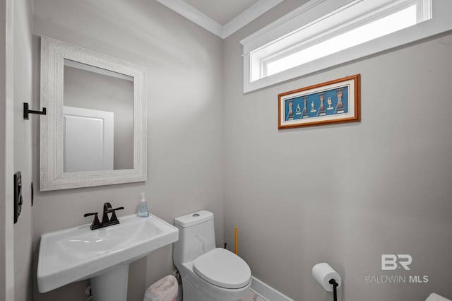 2420 Bienville Blvd, Dauphin Island, AL 36528 - half bath featuring a sink, toilet, and baseboards