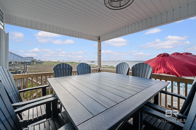 2420 Bienville Blvd, Dauphin Island, AL 36528 - deck featuring outdoor dining area and a water view
