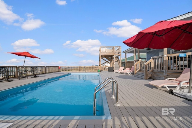 2420 Bienville Blvd, Dauphin Island, AL 36528 - view of pool with a deck, fence, and stairs