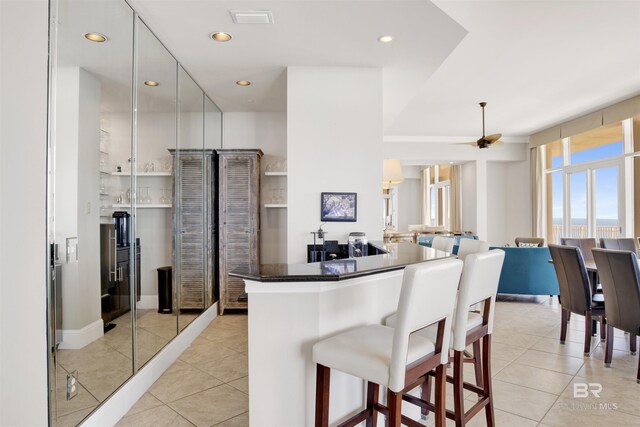 14237 Perdido Key Dr Unit Ph-1401, Pensacola, FL 32507 - kitchen featuring recessed lighting, a kitchen bar, visible vents, and light tile patterned flooring