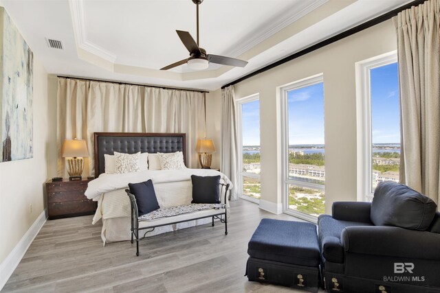 14237 Perdido Key Dr Unit Ph-1401, Pensacola, FL 32507 - bedroom featuring baseboards, multiple windows, a tray ceiling, and visible vents