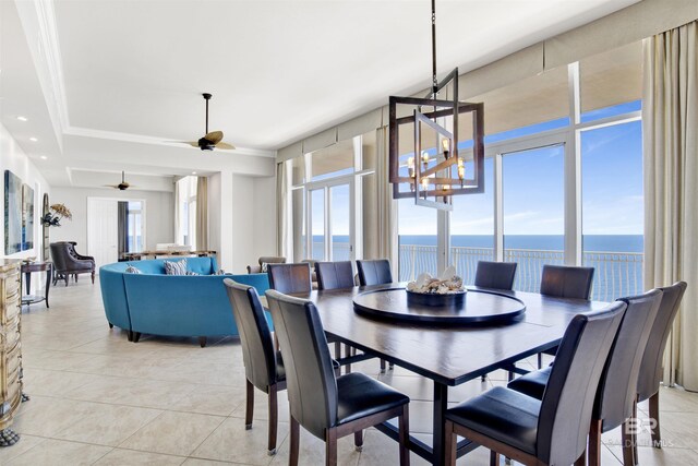 14237 Perdido Key Dr Unit Ph-1401, Pensacola, FL 32507 - dining area featuring plenty of natural light, a ceiling fan, a water view, and light tile patterned flooring