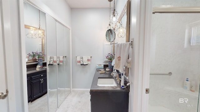 bathroom featuring vanity and a notable chandelier