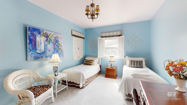 bedroom featuring carpet flooring and a notable chandelier