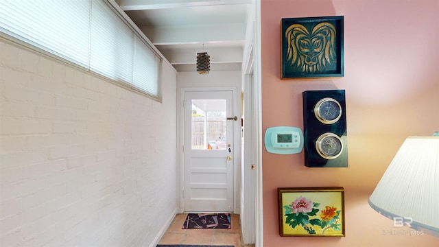 entryway with brick wall