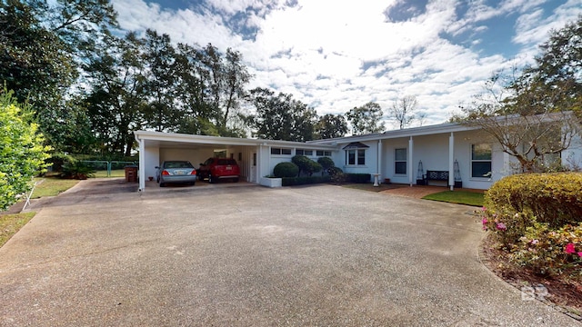 ranch-style home with a carport