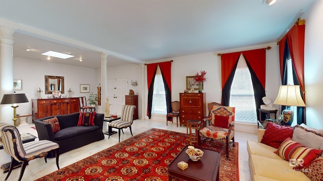 living room featuring decorative columns