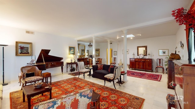 living room with decorative columns