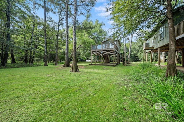 view of yard with a deck