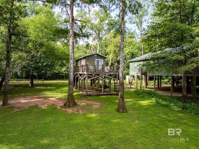 view of yard with a wooden deck