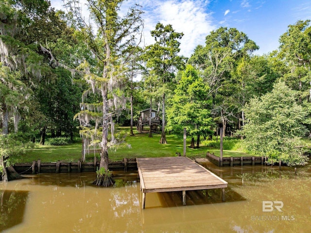 dock area featuring a water view and a lawn