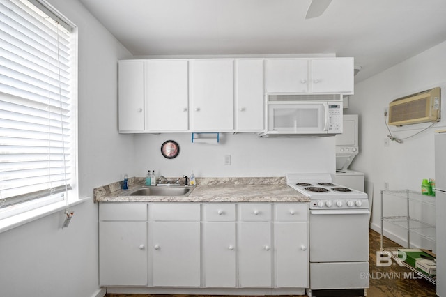 kitchen featuring white cabinets, white appliances, sink, and plenty of natural light