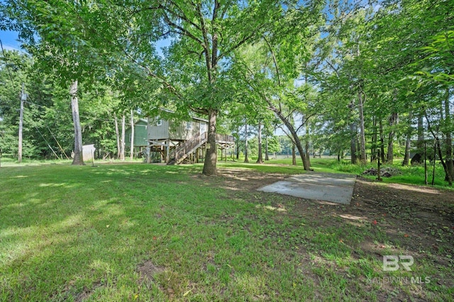 view of yard with a wooden deck