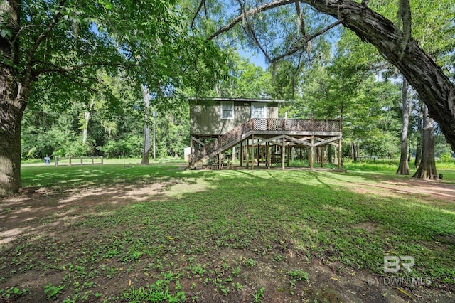 view of yard featuring a wooden deck