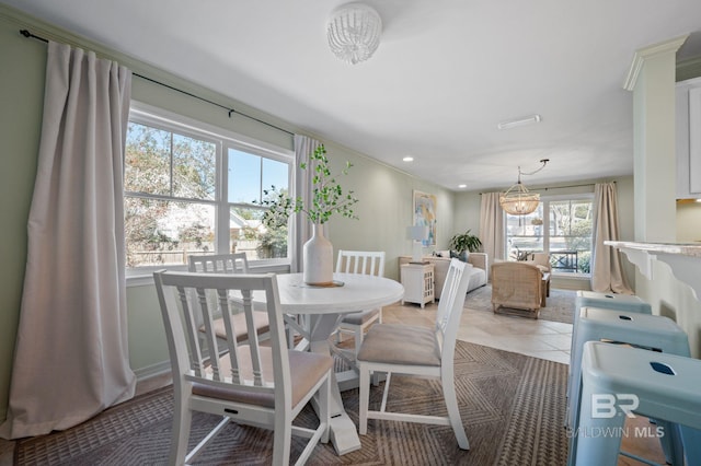 dining space featuring recessed lighting and light tile patterned floors