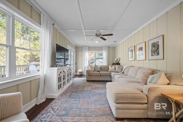 living area with dark wood-style flooring and a ceiling fan