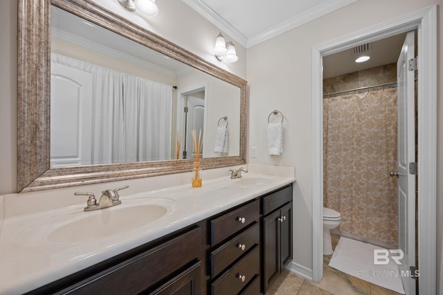 bathroom with toilet, double vanity, ornamental molding, and a sink