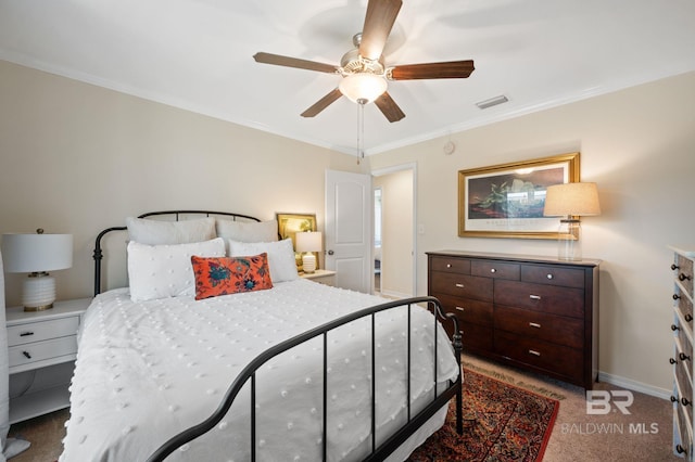 bedroom with light carpet, baseboards, visible vents, and crown molding