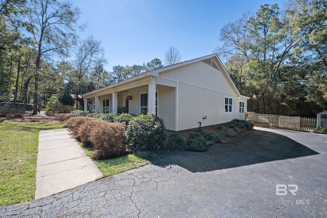 view of home's exterior featuring fence