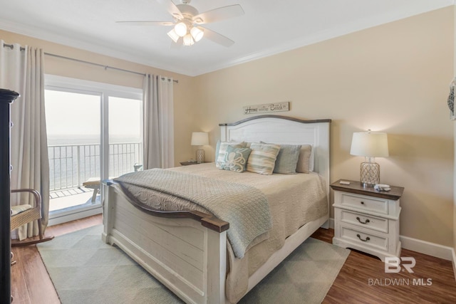 bedroom featuring multiple windows, hardwood / wood-style floors, access to exterior, and ceiling fan