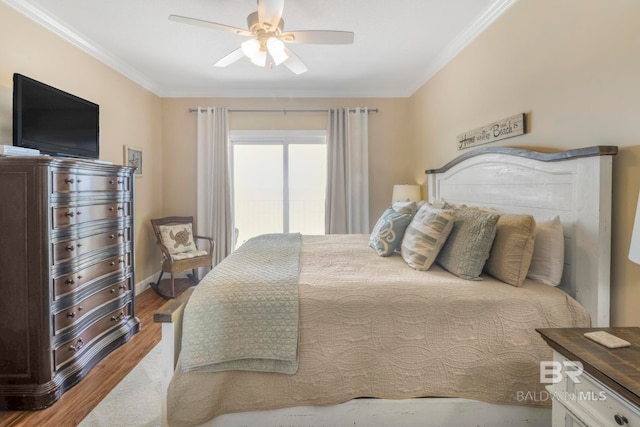 bedroom with ornamental molding, wood-type flooring, and ceiling fan