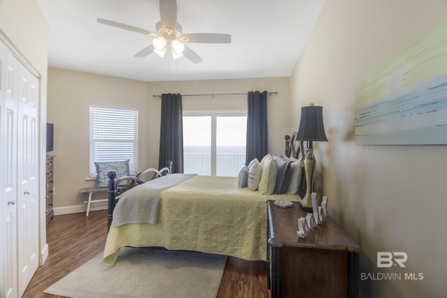 401 E Beach Blvd Unit 1704, Gulf Shores, AL 36542 - bedroom with access to outside, dark wood finished floors, baseboards, and ceiling fan