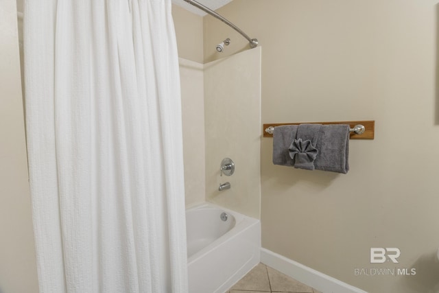 401 E Beach Blvd Unit 1704, Gulf Shores, AL 36542 - full bath with tile patterned floors, shower / bath combination with curtain, and baseboards