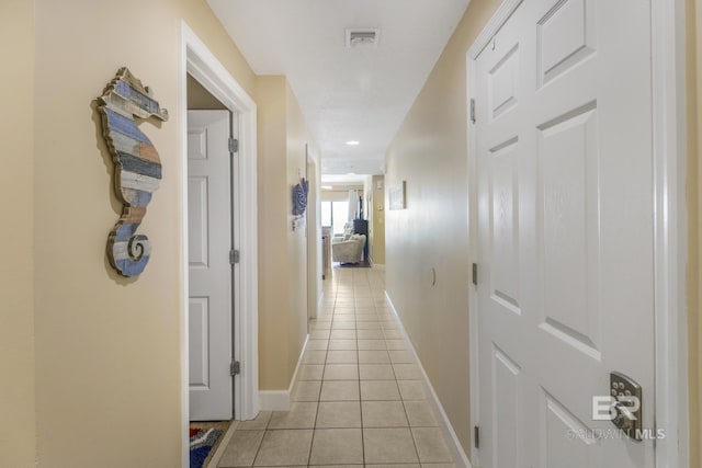 401 E Beach Blvd Unit 1704, Gulf Shores, AL 36542 - corridor with light tile patterned flooring and baseboards