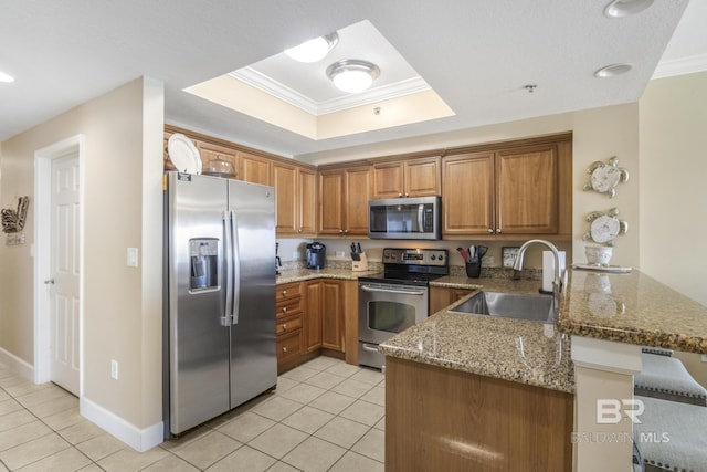 401 E Beach Blvd Unit 1704, Gulf Shores, AL 36542 - kitchen featuring appliances with stainless steel finishes, a sink, a peninsula, light tile patterned floors, and ornamental molding